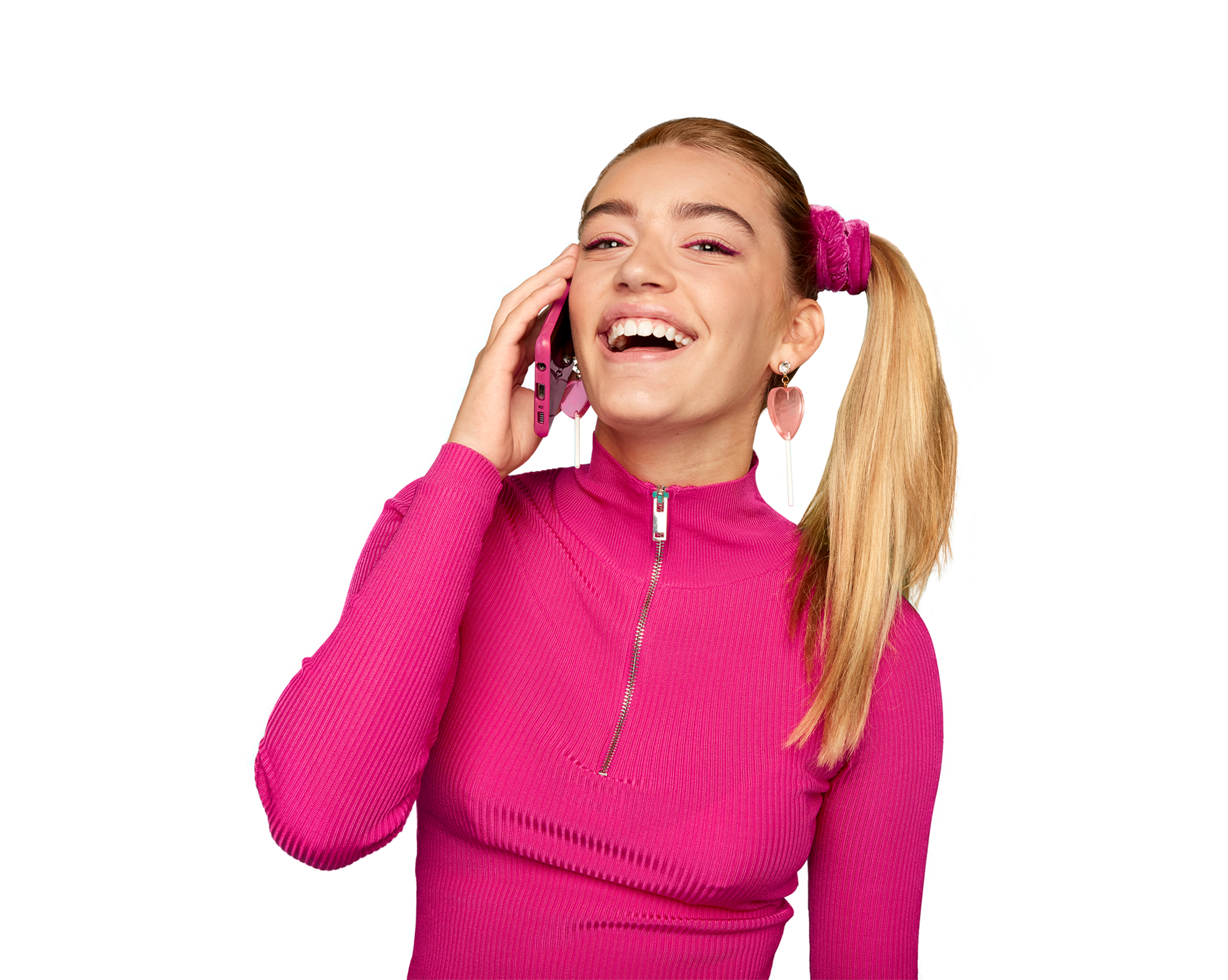 A smiling girl with a phone to her ear
